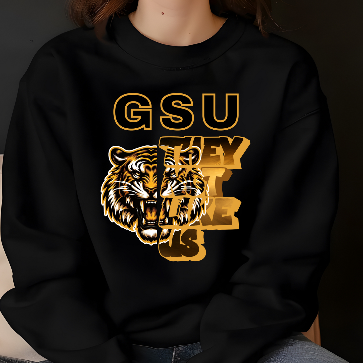 Black sweatshirt with gold tiger graphic and 'GSU THEY LIKE US' text on a dark background Grambling Football: GSU They Not Like Us Game Day Unisex Crewneck Sweatshirt