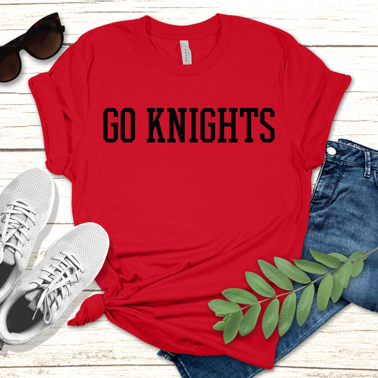 Red t-shirt with 'GO KNIGHTS' text, sunglasses, white sneakers, and jeans on a wooden surface. Knights School Spirit Shirt - Go Knights - School Pride T-Shirt