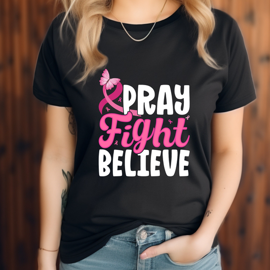 Person wearing a black t-shirt with 'Pray Fight Believe' text and pink ribbon design. Pink Ribbon T-Shirt: Pray Fight Believe Graphic Awareness Tee