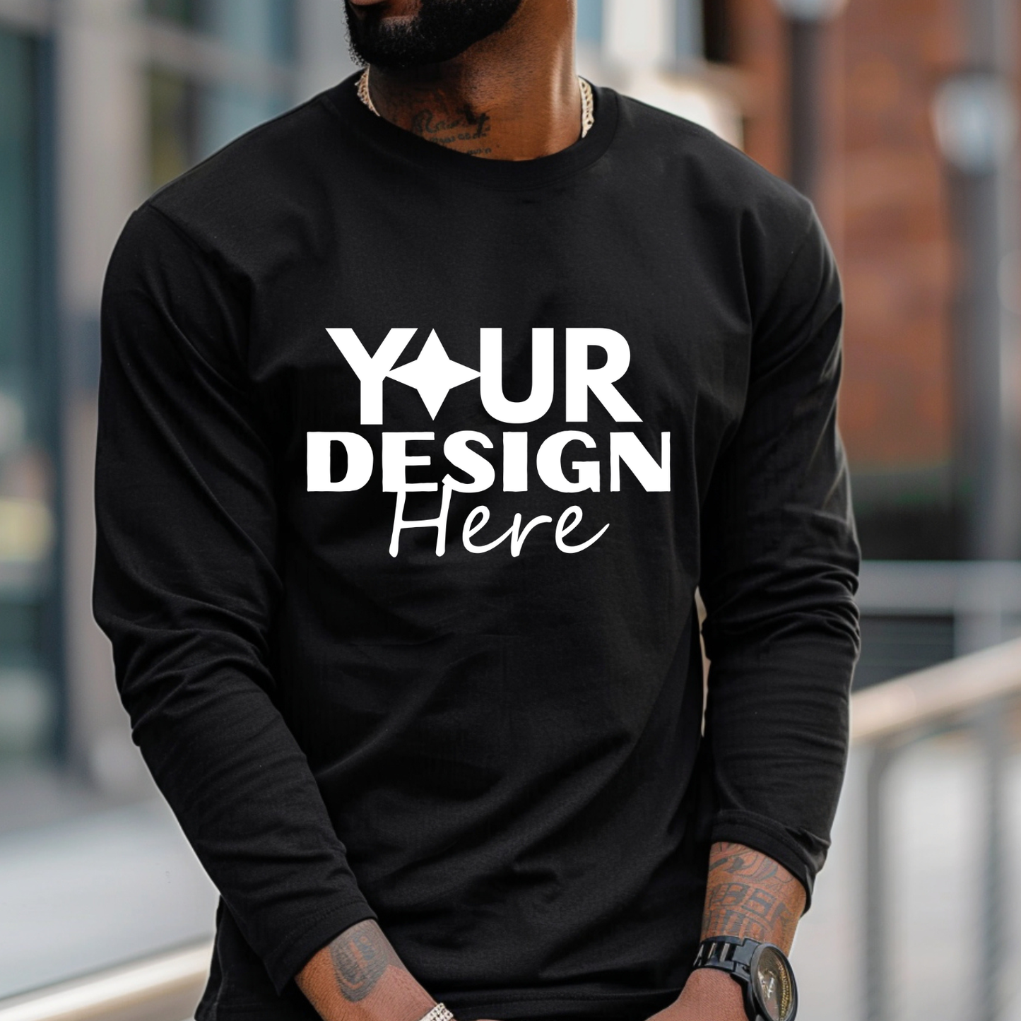 Black long-sleeve shirt with 'Your Design Here' text worn by a person outdoors. Taylor-Made Custom Long Sleeve Shirt - Personalized Design Tee - Front Design Only