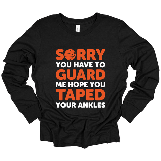 The "Sorry You Have to Guard Me, Hope You Taped Your Ankles" design adds a touch of humor and confidence, making this shirt a standout piece for any Basketball Fan.