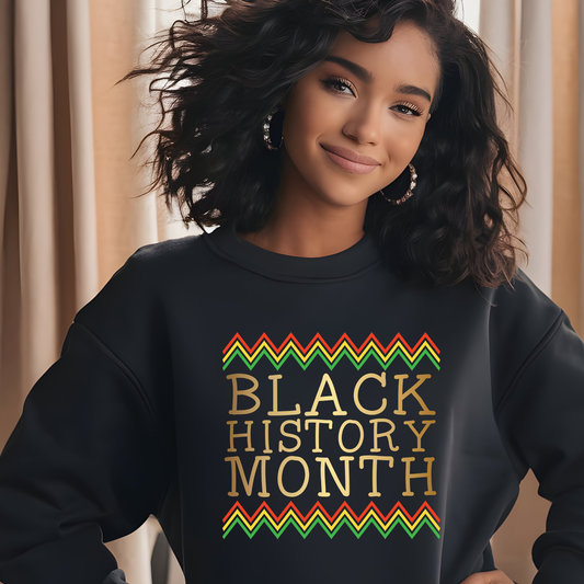 Person wearing a black sweatshirt with 'Black History Month' text and colorful design.