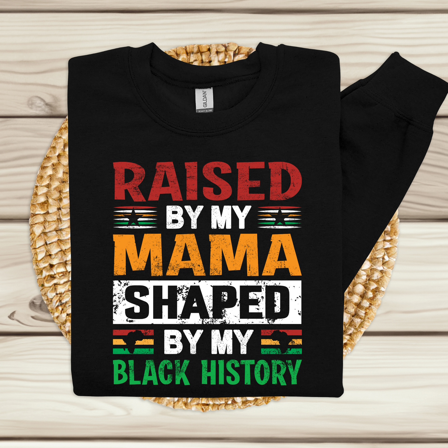 Black History Youth Crewneck Sweater with the phrase raised by my mama shaped by my black history sweater for