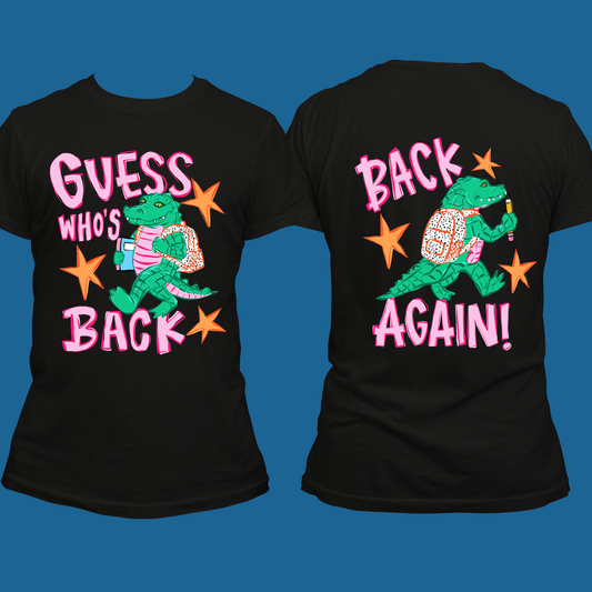 Front and back views of a black short-sleeve graphic t-shirt featuring a green alligator wearing a pink striped shirt and holding a pink drink, surrounded by orange stars, with the text 'GUESS WHO'S BACK' on the front and 'BACK AGAIN!' on the back, set against a solid blue background.
