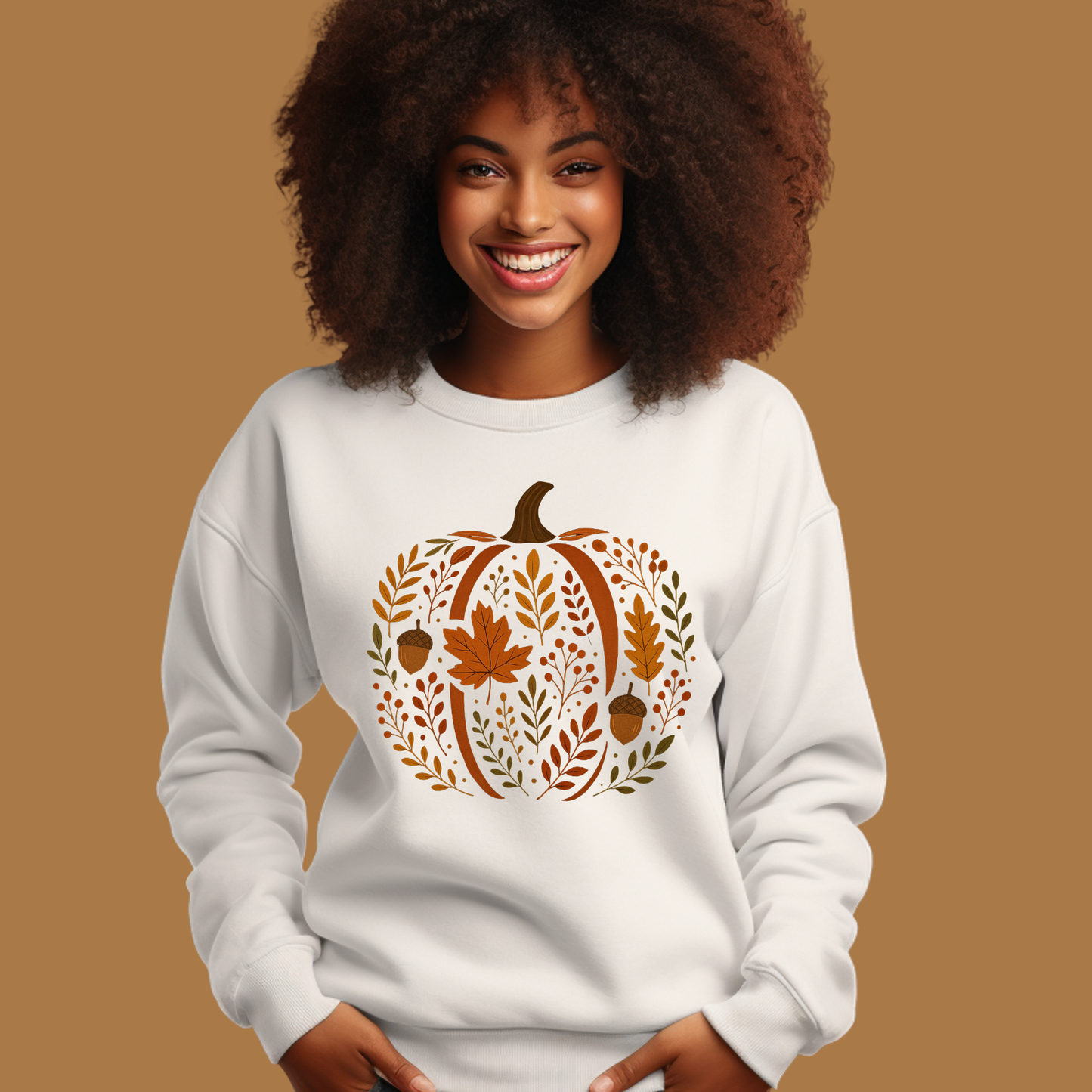 Woman wearing a white sweatshirt with a decorative pumpkin design on a brown background Chic Botanical Pumpkin Sweatshirt: Fall Floral Crewneck Sweatshirt