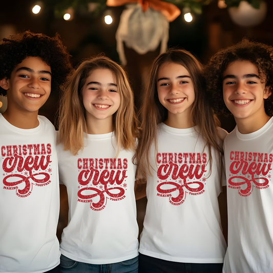 Four children wearing 'Christmas Crew' shirts with a festive background. Christmas Crew Making Memories Together T-Shirt - Family Matching Holiday Sweater