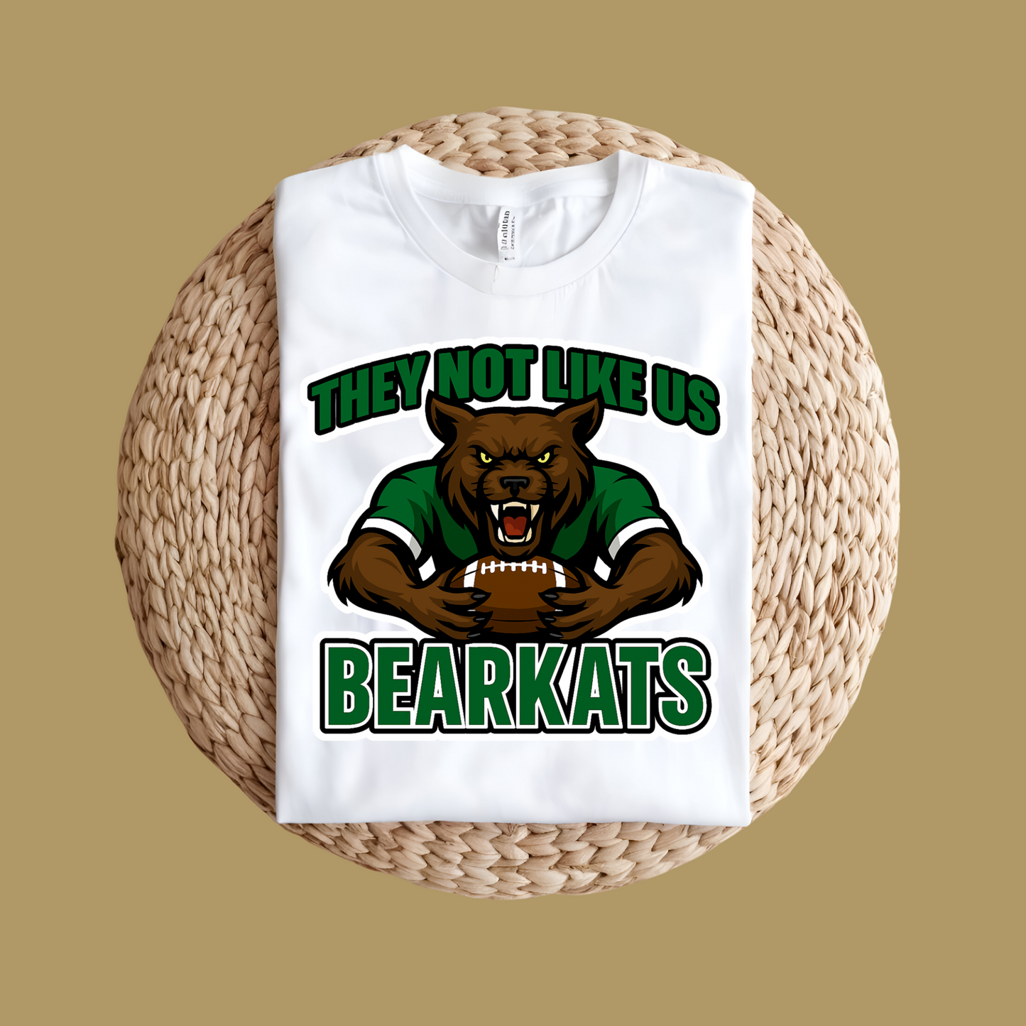 White t-shirt with bear graphic and text 'THEY NOT LIKE US BEARKATS' on a woven surface. Custom Mascot Shirt - BearKats They Not Like Us Game Day Spirit Tee