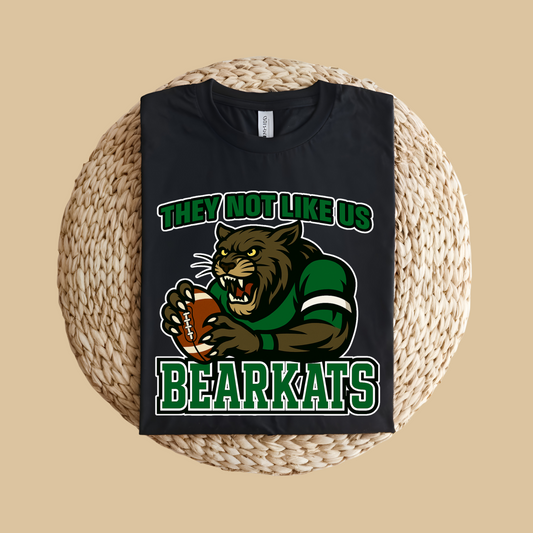Black t-shirt with bearkats graphic and text on a woven mat Custom Mascot Shirt - BearKats They Not Like Us Game Day Spirit Tee Version 2