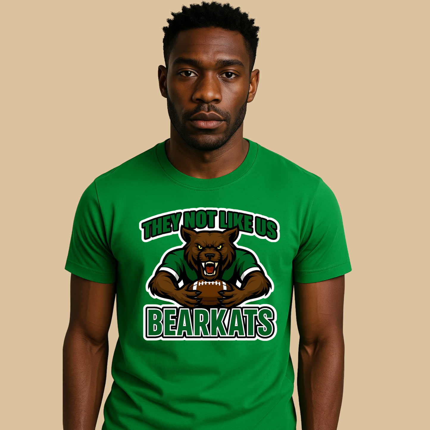 Man wearing a green t-shirt with a bear graphic and text on a beige background Custom Mascot Shirt - BearKats They Not Like Us Game Day Spirit Tee