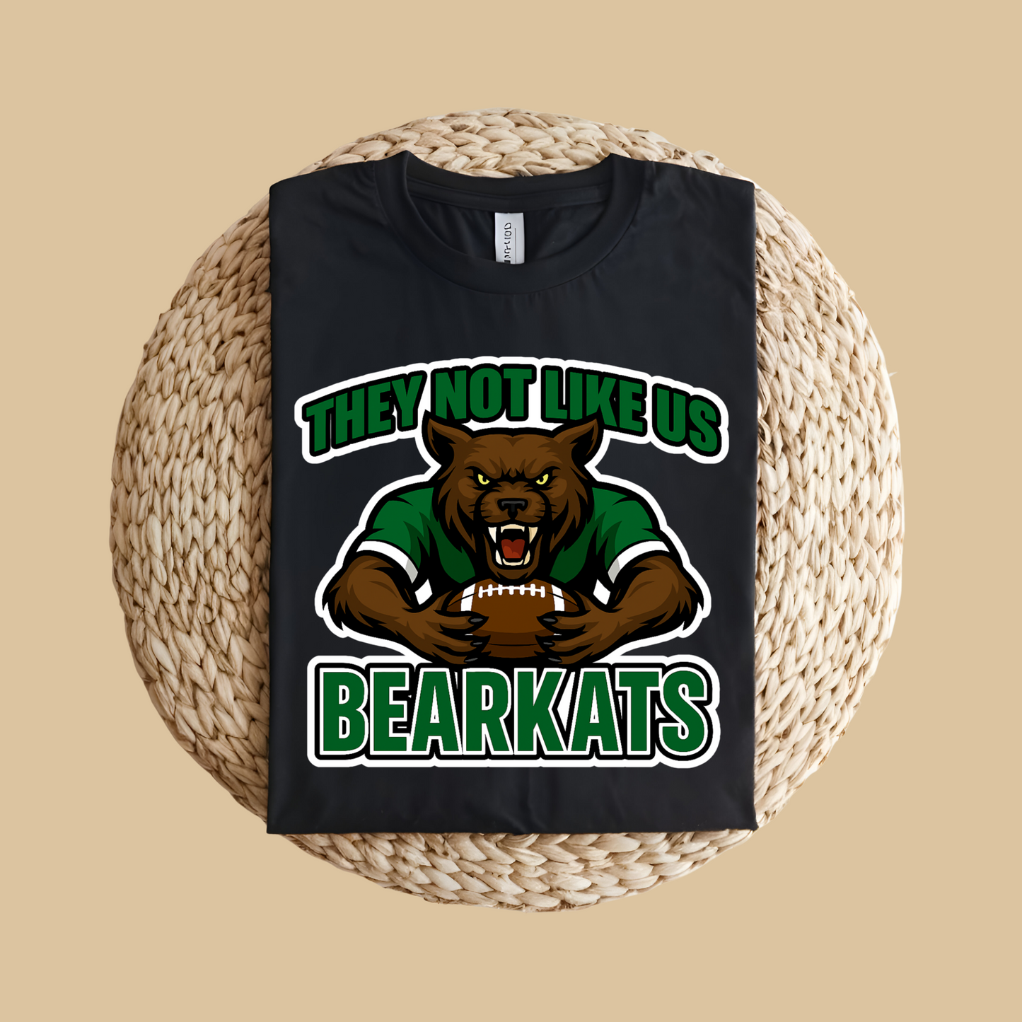 Black t-shirt with bear graphic and text 'THEY NOT LIKE US BEARKATS' on a woven mat. Custom Mascot Shirt - BearKats They Not Like Us Game Day Spirit Tee