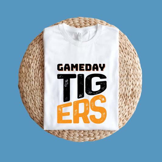 White t-shirt with 'GAMEDAY TIGERS' text on a woven surface with blue background - Custom Mascot Shirt - Game Day Tigers - School Spirit Tee Shirt