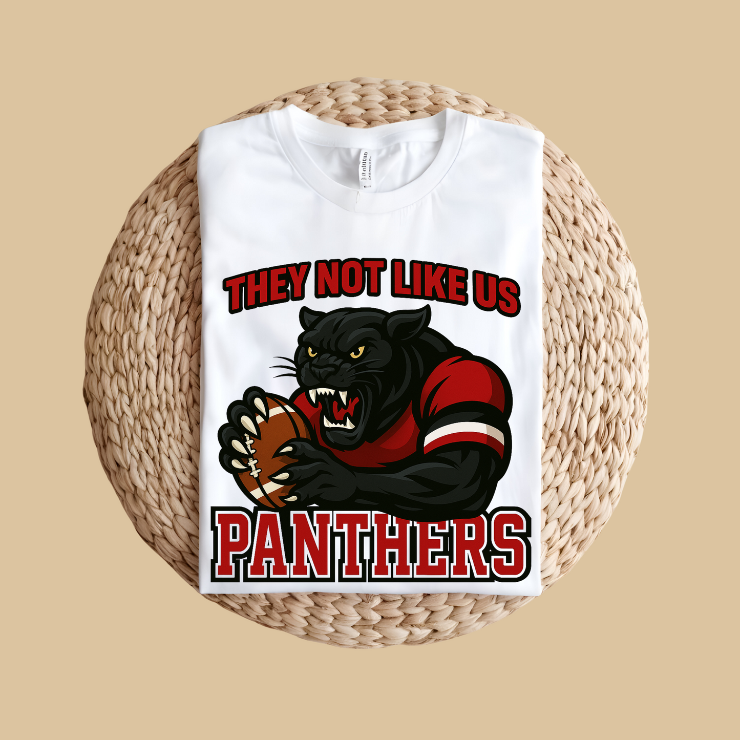 White t-shirt with a panther graphic and text on a woven surface Custom Mascot Shirt - Panthers They Not Like Us Game Day Wear