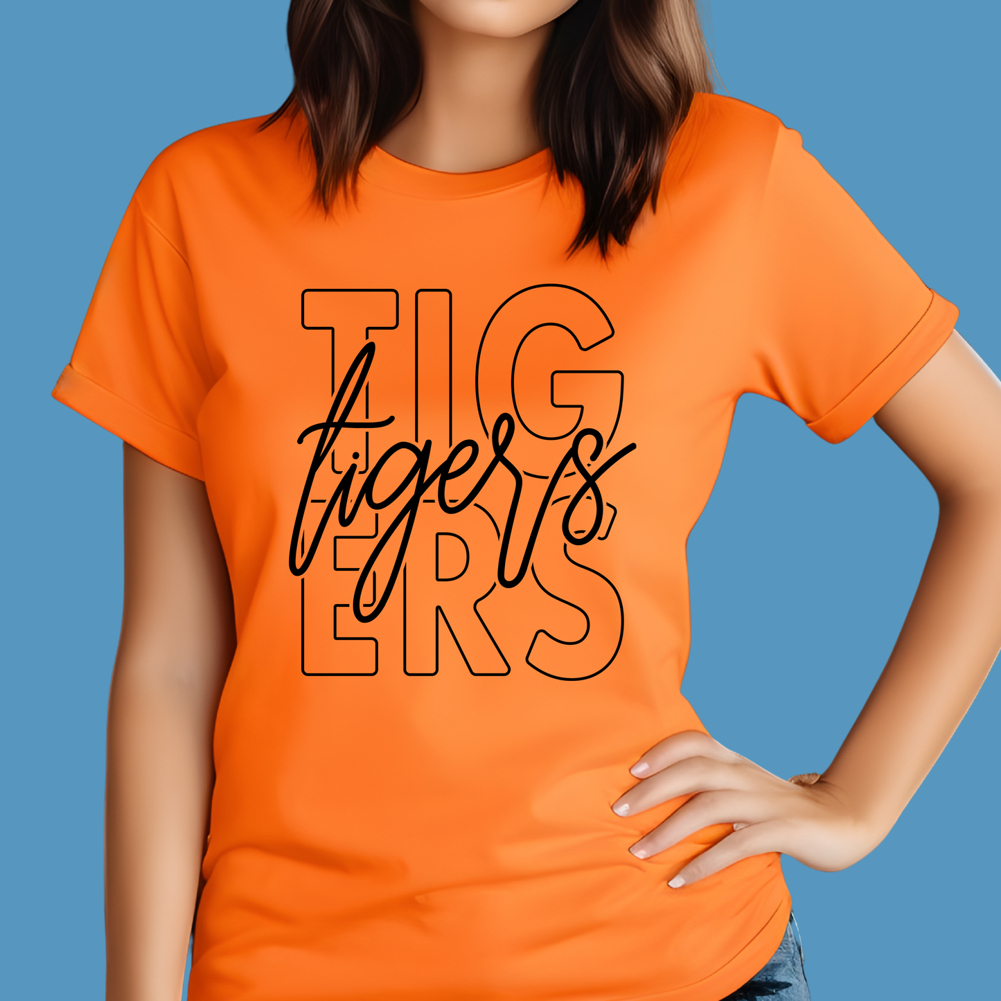 Person wearing an orange t-shirt with 'Tigers' printed on it against a blue background Custom Mascot Shirt - Tigers Mascot Game Day Spirit Wear