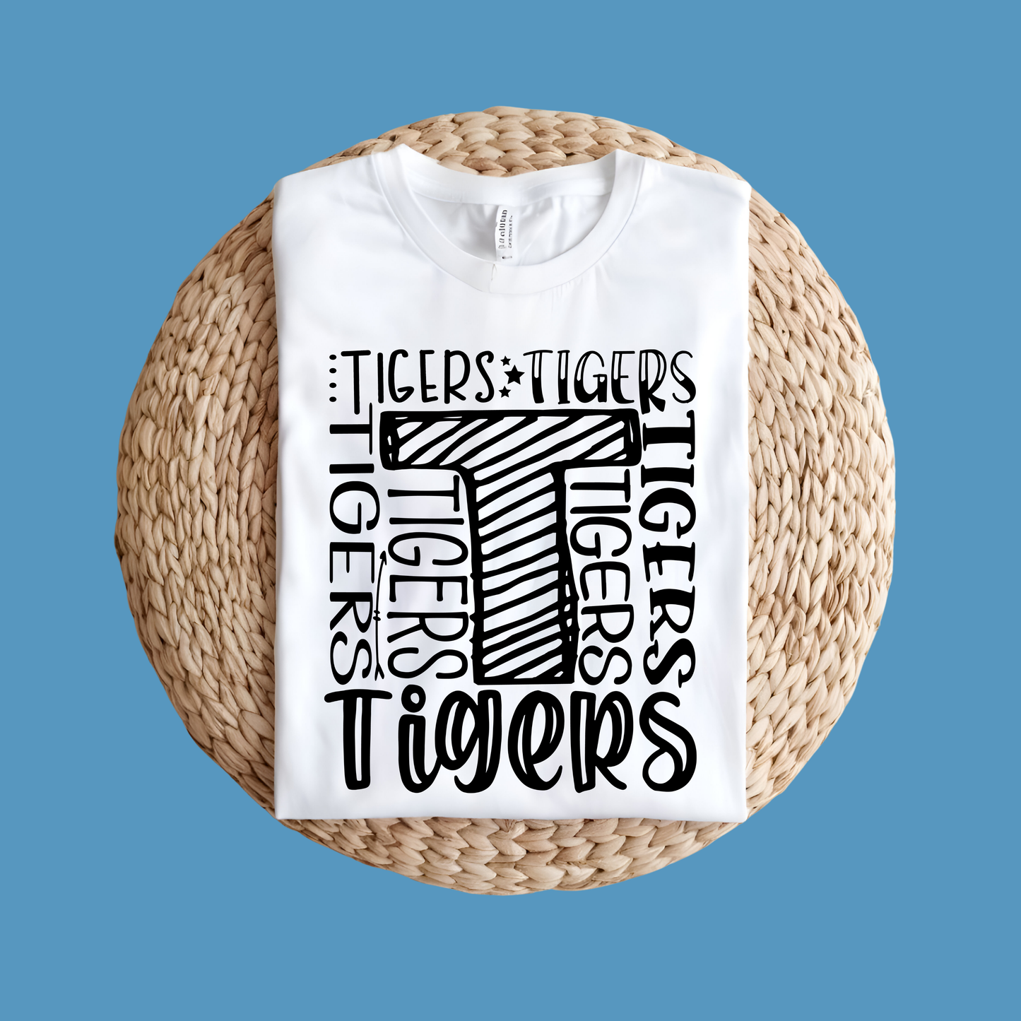 White t-shirt with Tigers logo and text on a woven surface, Custom Mascot Shirt - Tigers Pride Game Day Spirit Wear