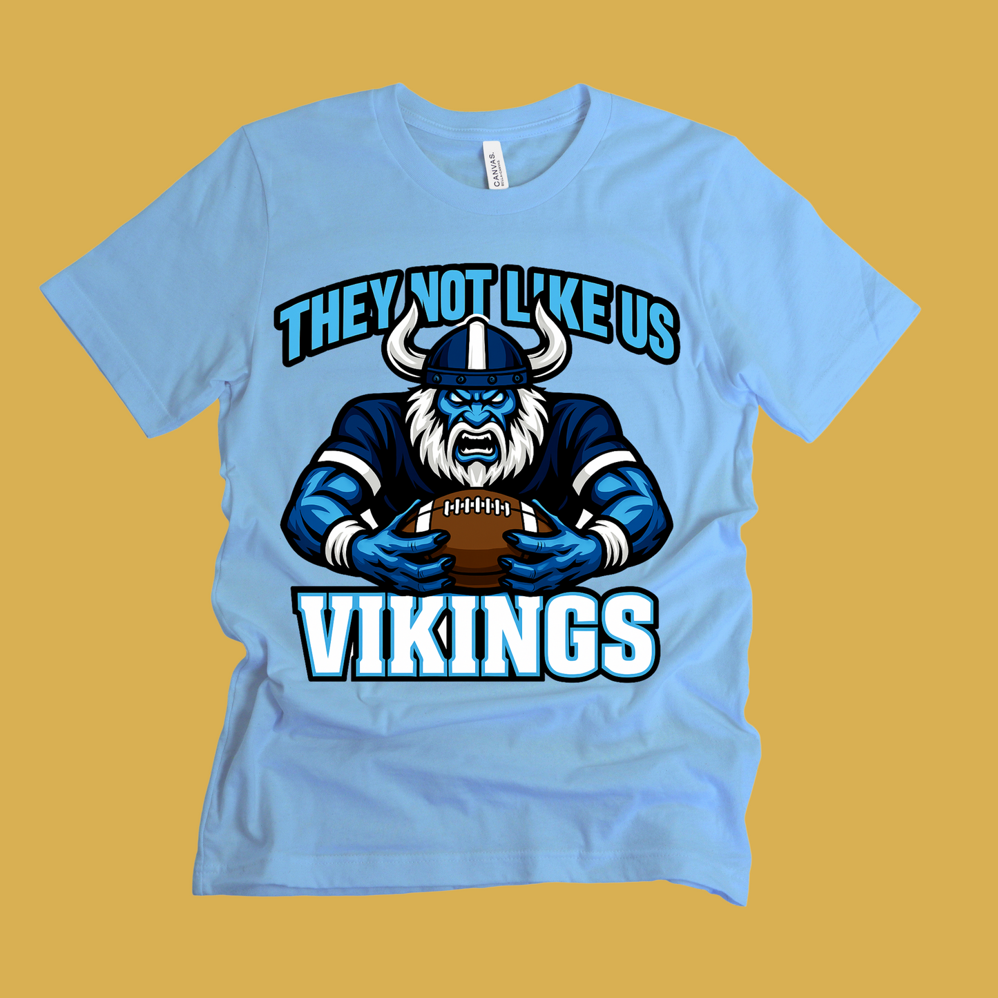 Light blue t-shirt with Viking graphic and text on a yellow background Custom Mascot Shirt - Vikings They Not Like Us Game Day Wear