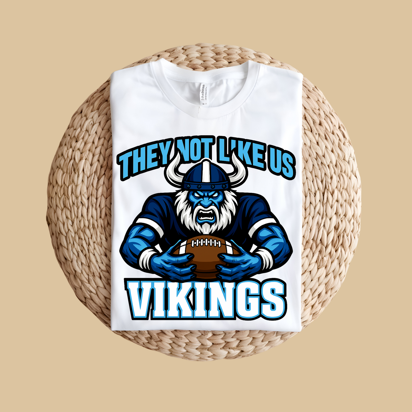 White tank top with Viking graphic and text on a woven surface Custom Mascot Shirt - Vikings They Not Like Us Game Day Wear