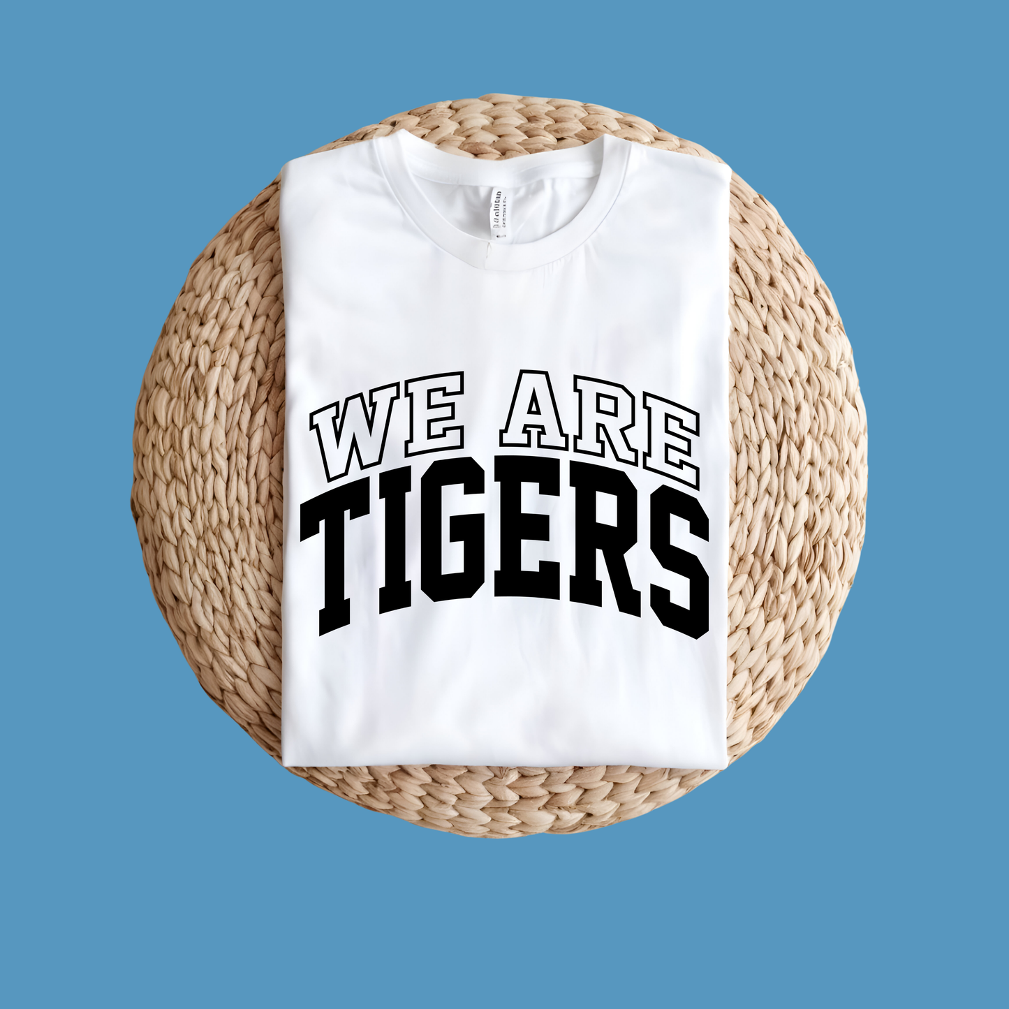 White sweatshirt with 'WE ARE TIGERS' text on a woven mat against a blue background Custom Mascot Shirt - We Are Tigers Game Day Spirit Wear