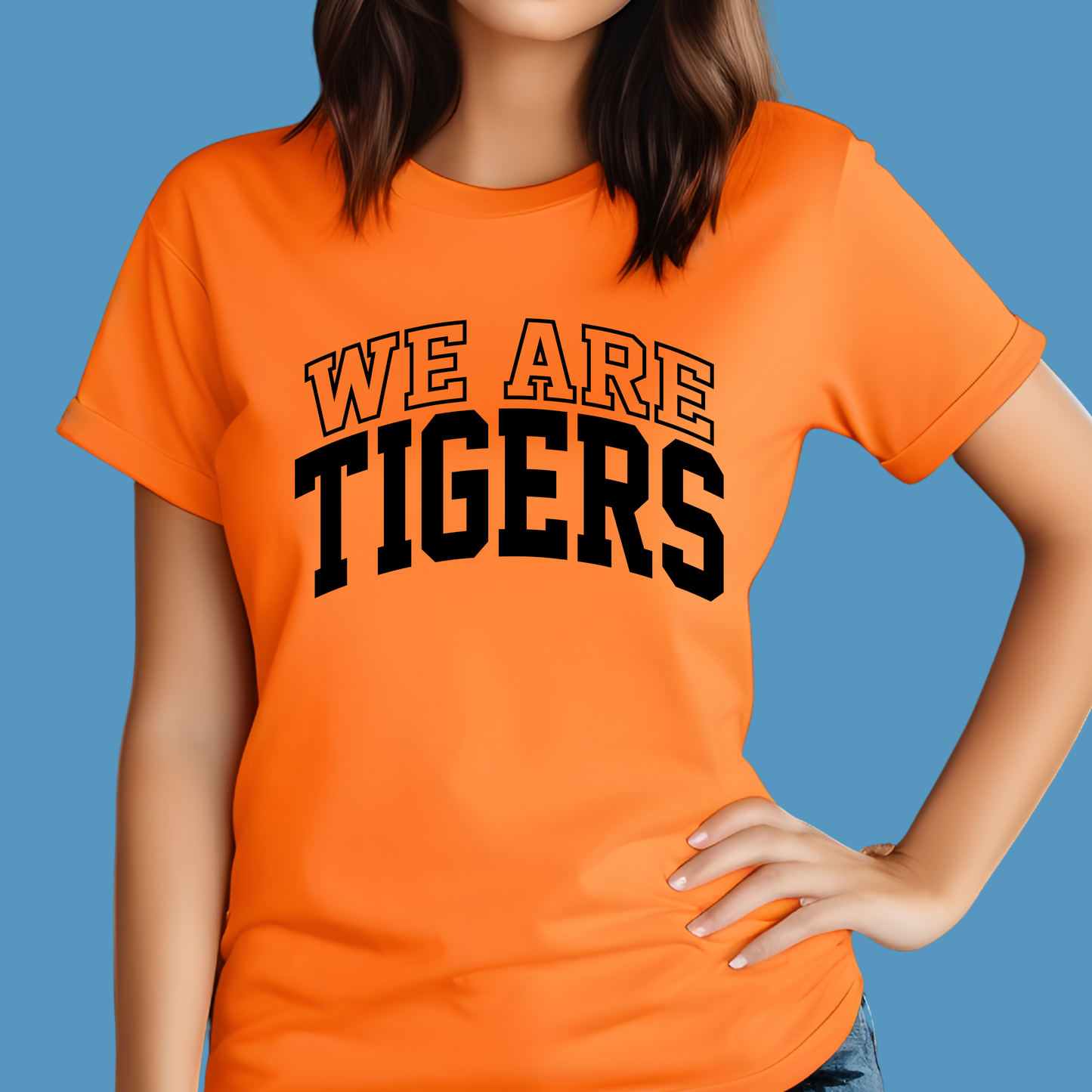 Person wearing an orange t-shirt with 'WE ARE TIGERS' text on a blue background Custom Mascot Shirt - We Are Tigers Game Day Spirit Wear
