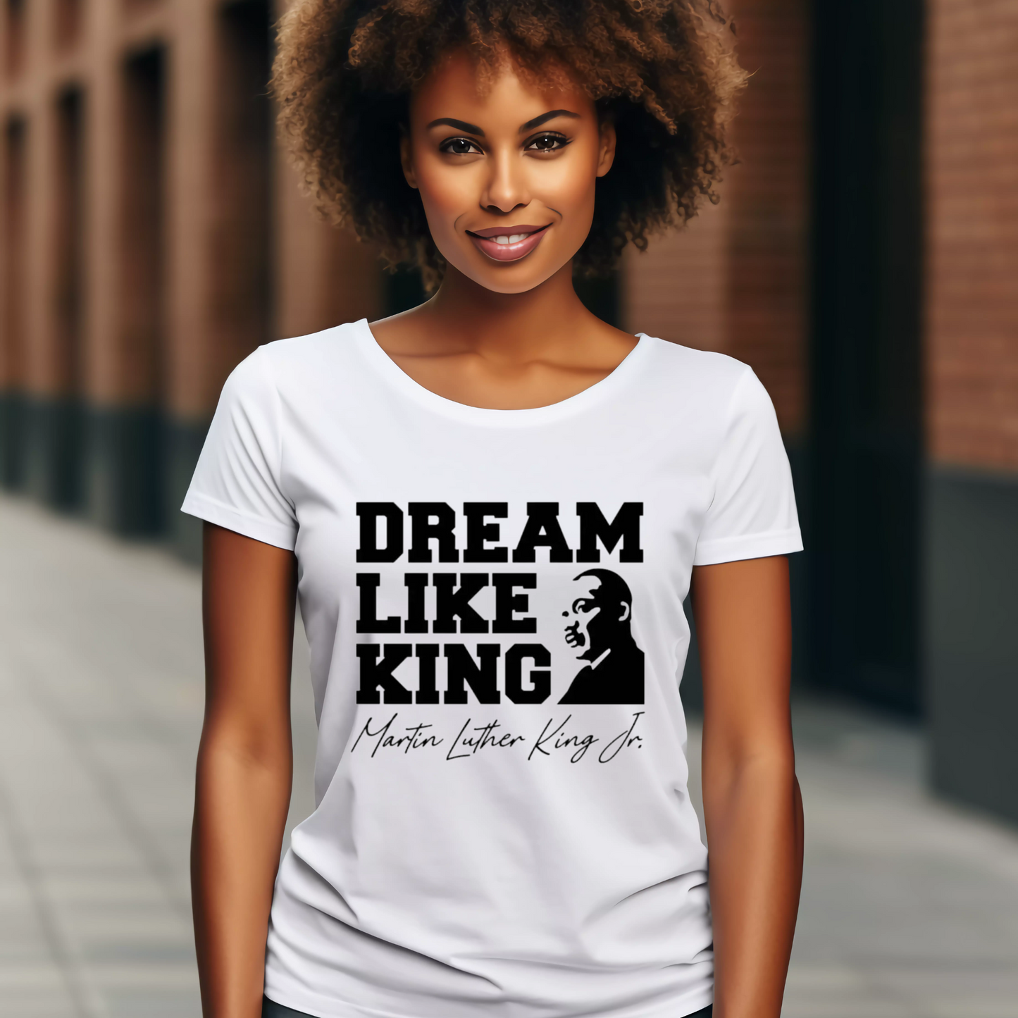 black women wearing a white shirt with the phrase "DREAM LIKE KING" and an image of Martin Luther King Jr., celebrating Black heritage and MLK Birthday with a t-shirt