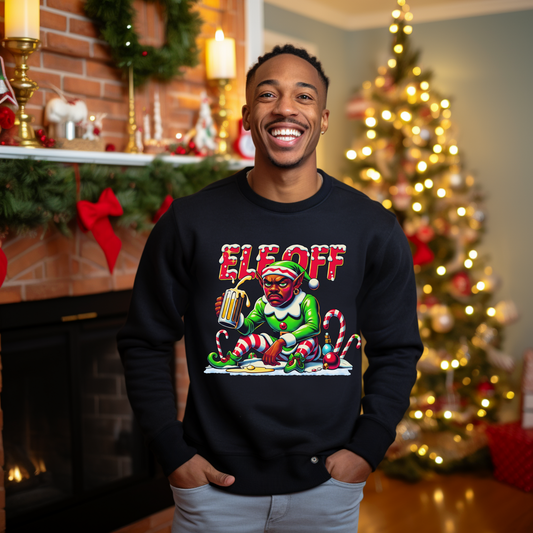 Man wearing a black sweatshirt with a colorful graphic design in a festive room with a Christmas tree.