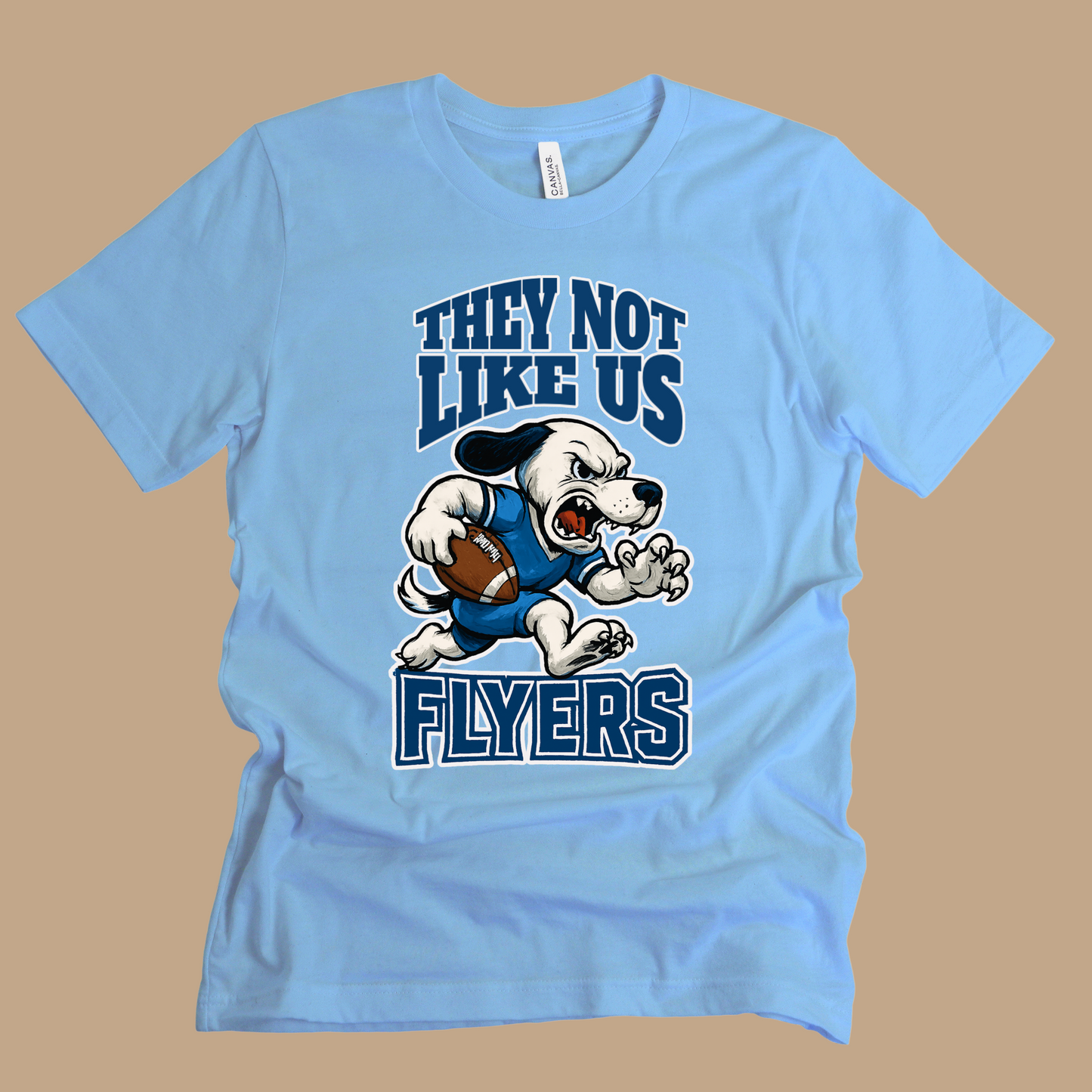 Light blue t-shirt with a graphic of a dog holding a football and text on a brown background Flyers Mascot T-Shirt: "They Not Like Us" Flyers Game Day Graphic Tee