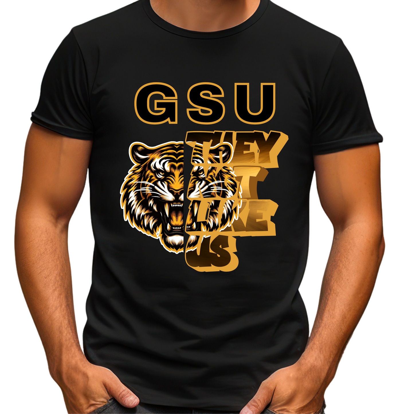 Black t-shirt with gold tiger graphic and 'GSU THEY LOVE US' text on a white background Grambling State Tigers T-Shirt - They Not Like Us - Game Day Statement Tee