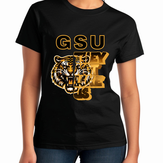 Black t-shirt with gold tiger graphic and 'GSU THEY LIKE US' text on a white background Grambling State Tigers T-Shirt - They Not Like Us - Game Day Statement Tee