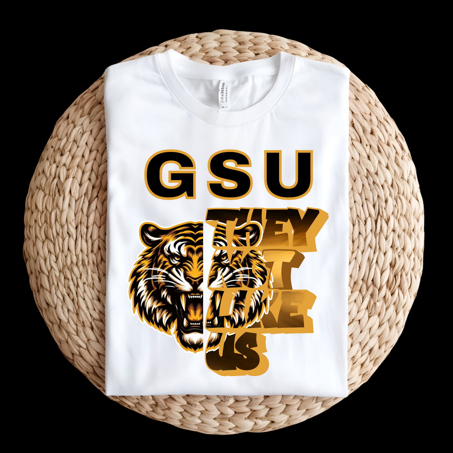 White sweatshirt with tiger graphic and 'GSU THEY LIKE US' text on a woven surface Grambling State Tigers T-Shirt - They Not Like Us - Game Day Statement Tee