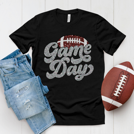 Black t-shirt with 'Game Day' text, denim shorts, and football on a white background