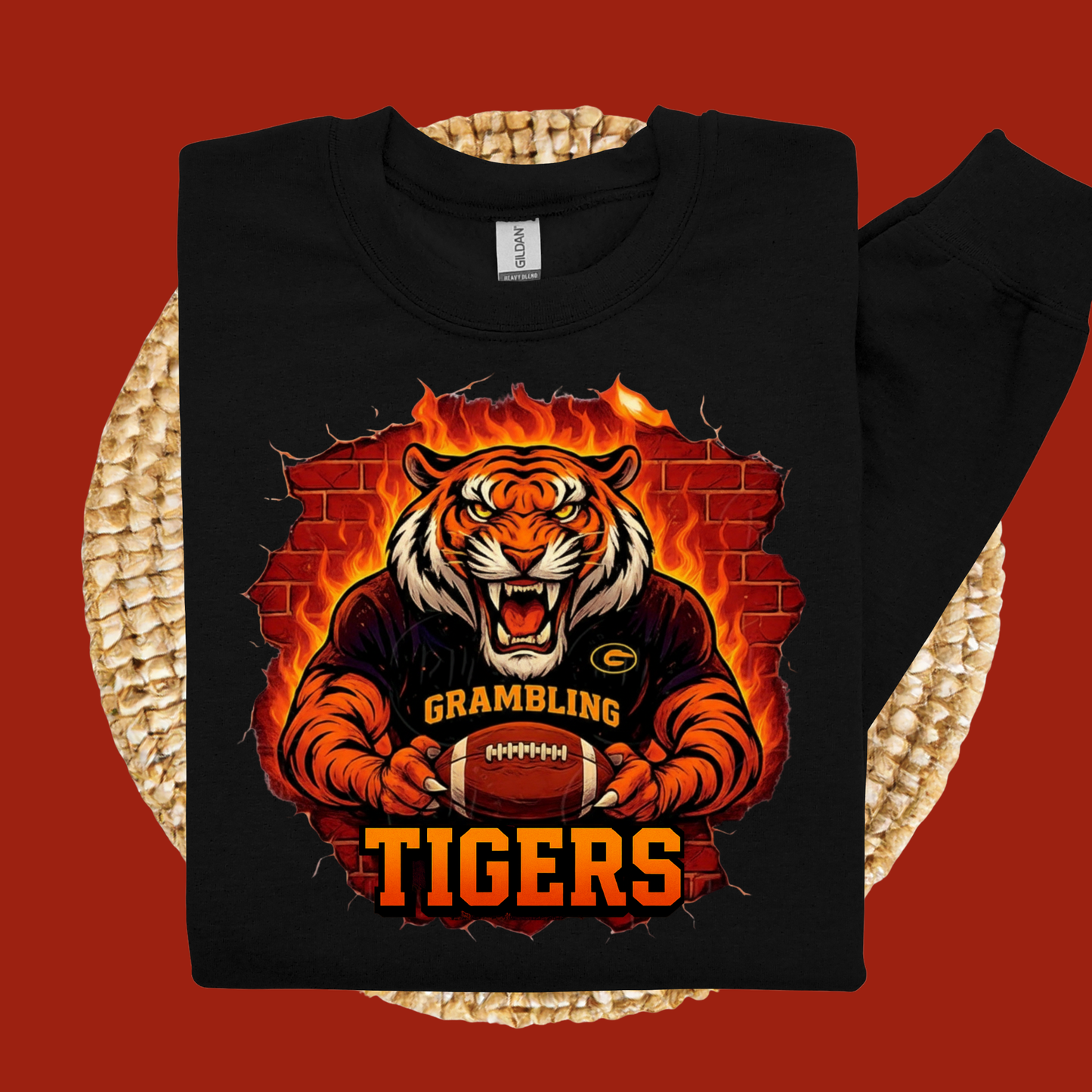 Black sweatshirt with a tiger graphic and 'Grambling Tigers' text on a woven surface.