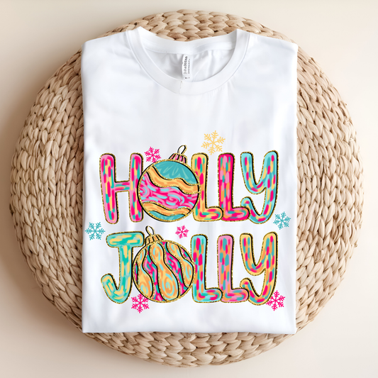White sweatshirt with 'Holly Jolly' design on a woven surface