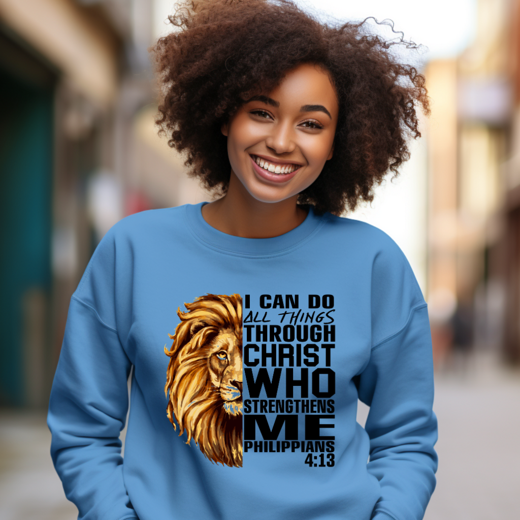 Lion Crewneck Sweater – I Can Do All Things Through Christ Sweater Women wearing a Light Blue Christian faith sweater with "I can do all things through Christ who strengthens me" and Lion of Judah design. Inspirational Christian and Christian Faith Sweater along with a Lion of Judah