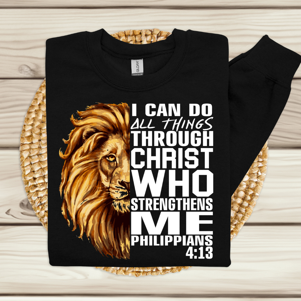 Lion Christian Sweatshirt "I Can Do All Things Through Christ" Unisex Women wearing a Black Christian faith sweater with "I can do all things through Christ who strengthens me" and Lion of Judah design. Inspirational Christian sweatshirt