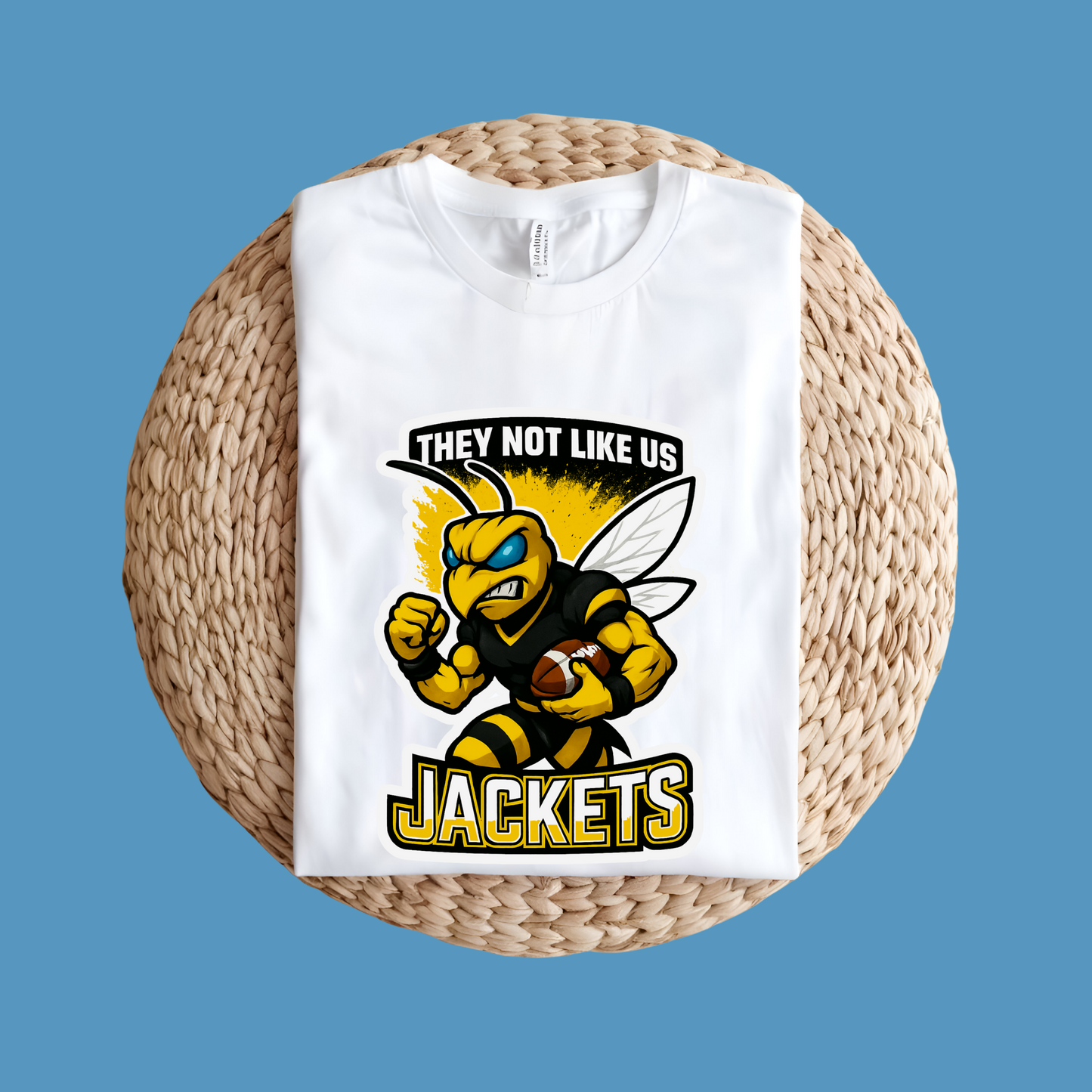White t-shirt with a bee graphic and text on a woven surface Jackets Mascot Shirt - Bold Yellow Jacket They Not Like Us Spirit Tee