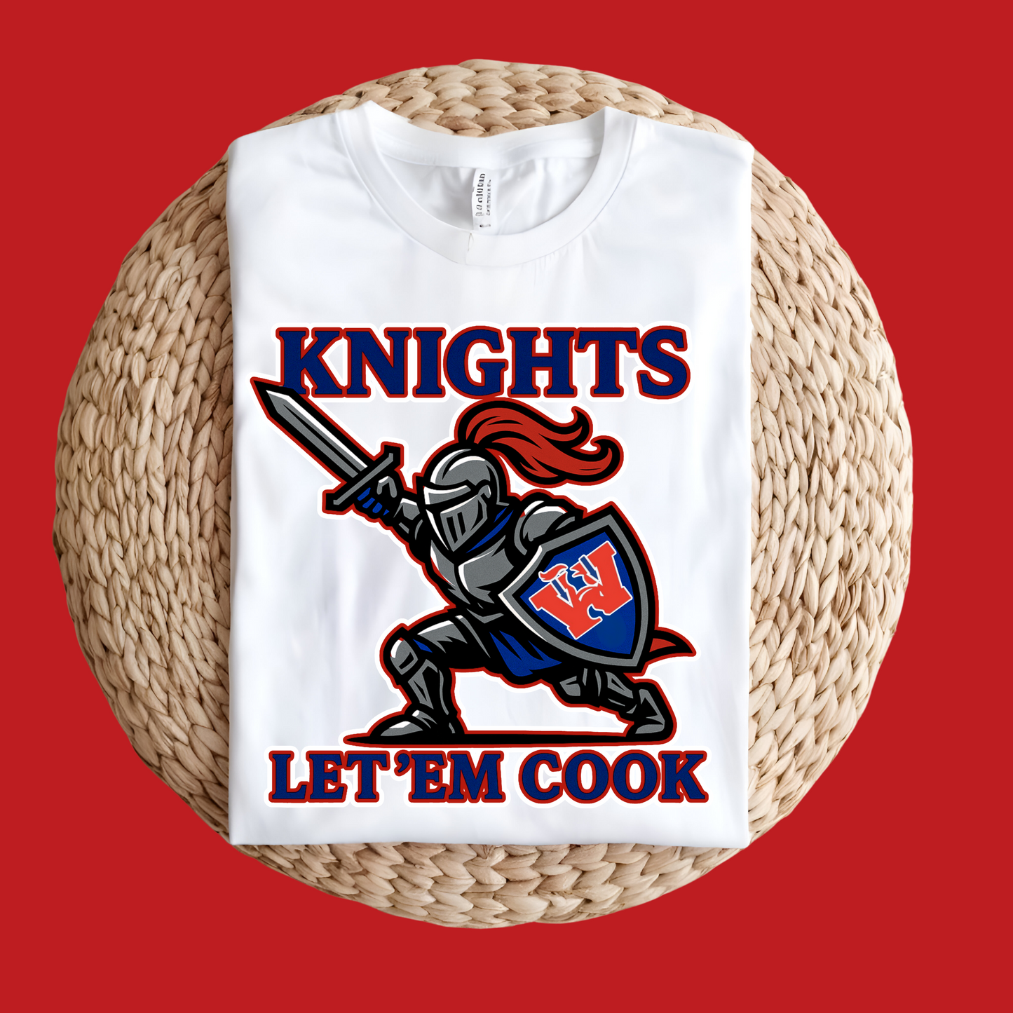 White t-shirt with a knight graphic and text 'Knights Let 'Em Cook' on a red background Woodlawn Knights Shirt: "Let'em Cook" Bold Game Day T-Shirt