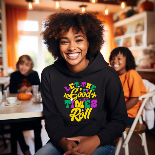 Person wearing a black hoodie with colorful text in a casual indoor setting