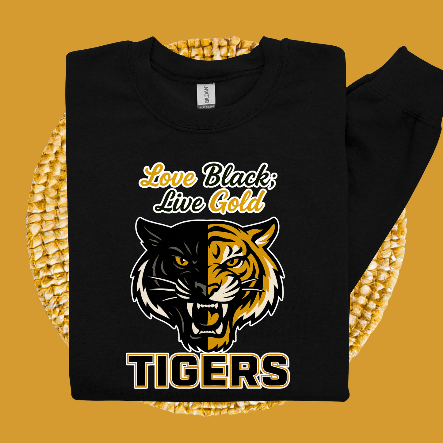 Black sweatshirt with tiger design and 'Love Black, Live Gold' text on a yellow background Grambling Tigers Sweater: Love Black; Live Gold Unisex Bold Crewneck Sweater