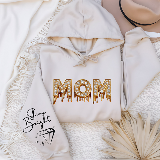 Women wearing sand mom faux diamond sparking bright mom sweatshirt a perfect mom hoodie for chic mom gift on her birthday or Mother's Day gift.