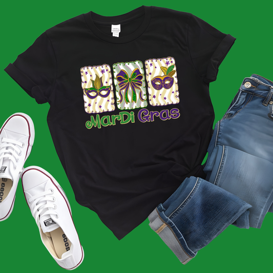 Black t-shirt with Mardi Gras design, white sneakers, and blue shorts on a green background