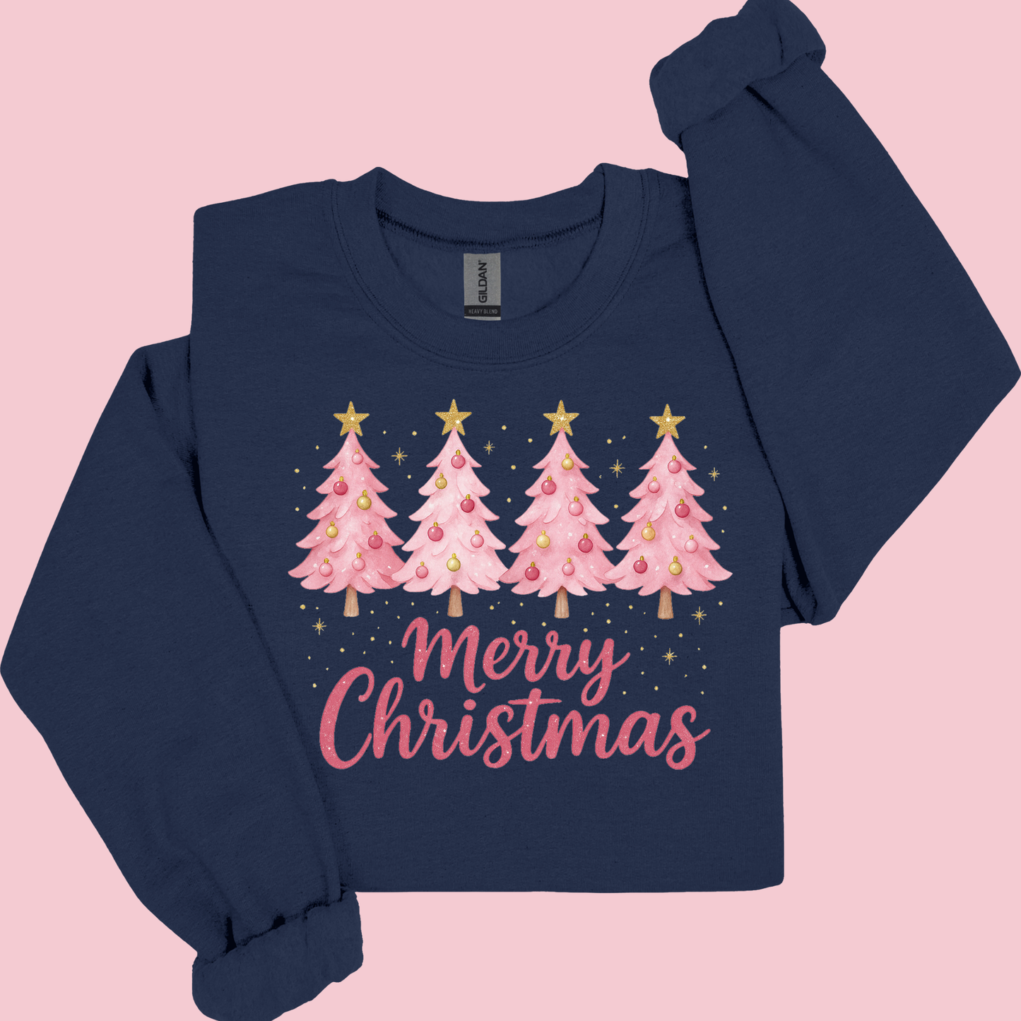 Navy blue sweatshirt with pink Christmas tree design and 'Merry Christmas' text on a pink background