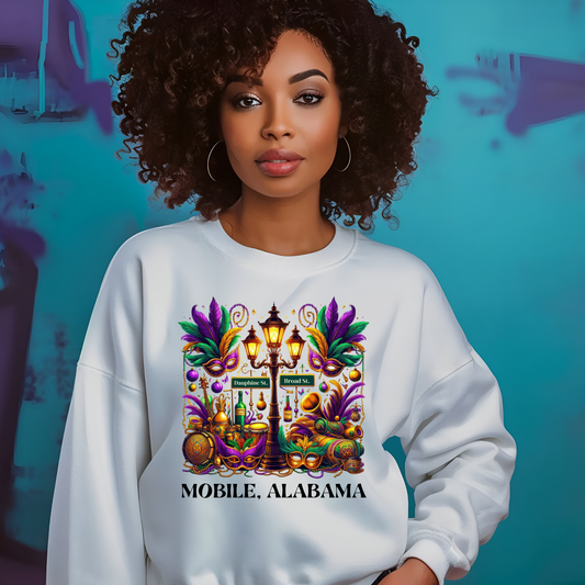Woman wearing a white sweatshirt with a colorful design and text, standing against a blue background.