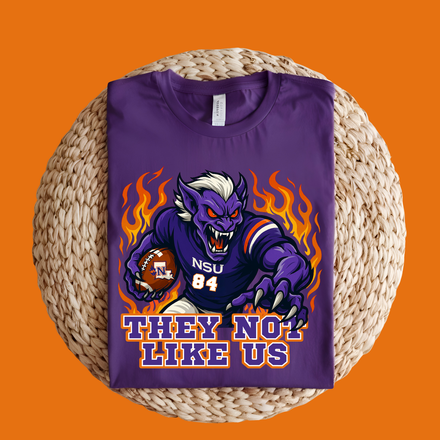 Purple t-shirt with a graphic design on an orange background Northwestern Demons Game Day T-Shirt - Demons "They Not Like Us" Football Tee