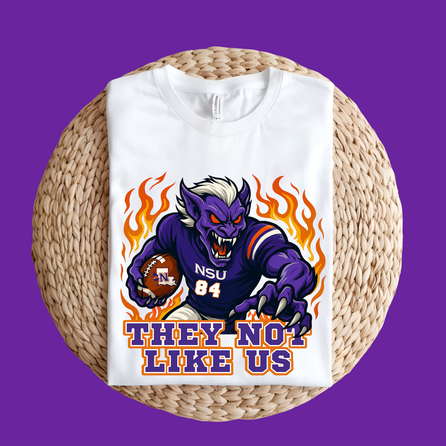 White t-shirt with a purple creature graphic and text on a woven surface Northwestern Demons Game Day T-Shirt - Demons "They Not Like Us" Football Tee