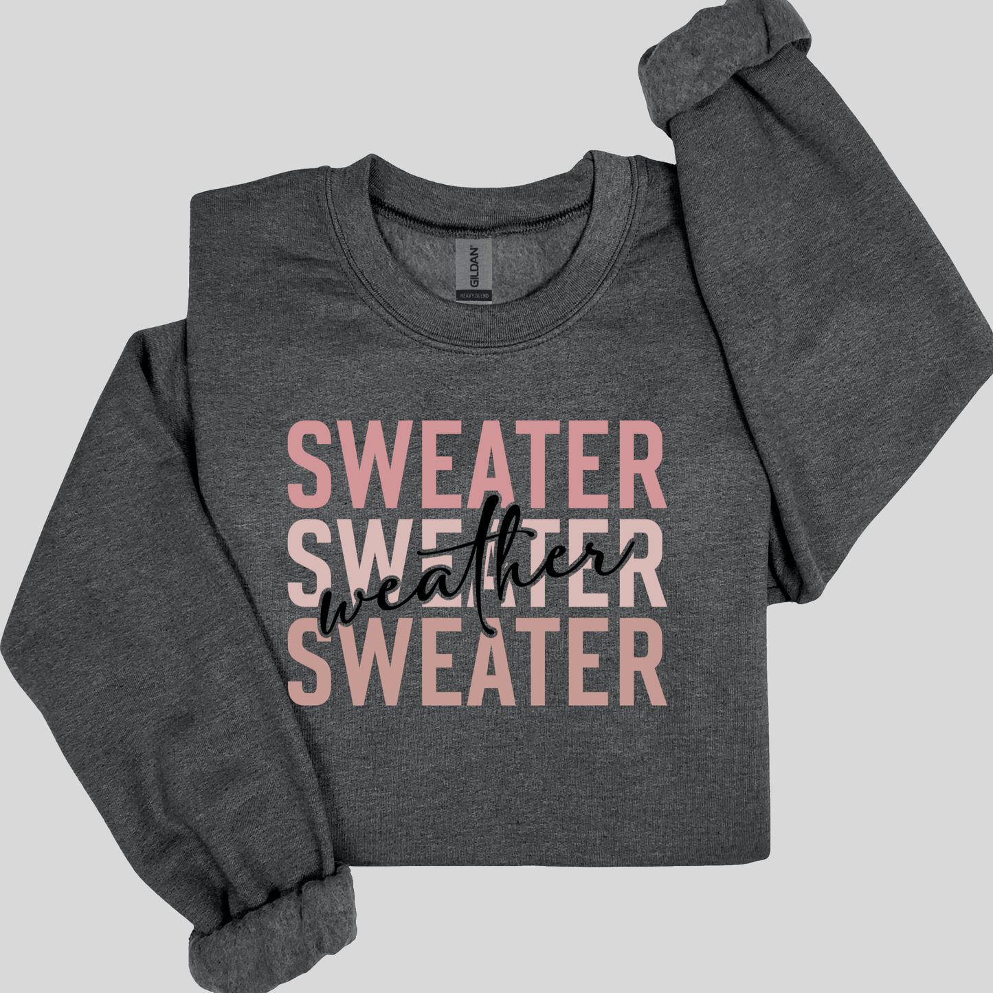 Gray sweatshirt with 'Sweater weather sweater' text on a light gray background Sweater Weather - Cute and Chic Minimalist Fall Crewneck Cozy Sweater