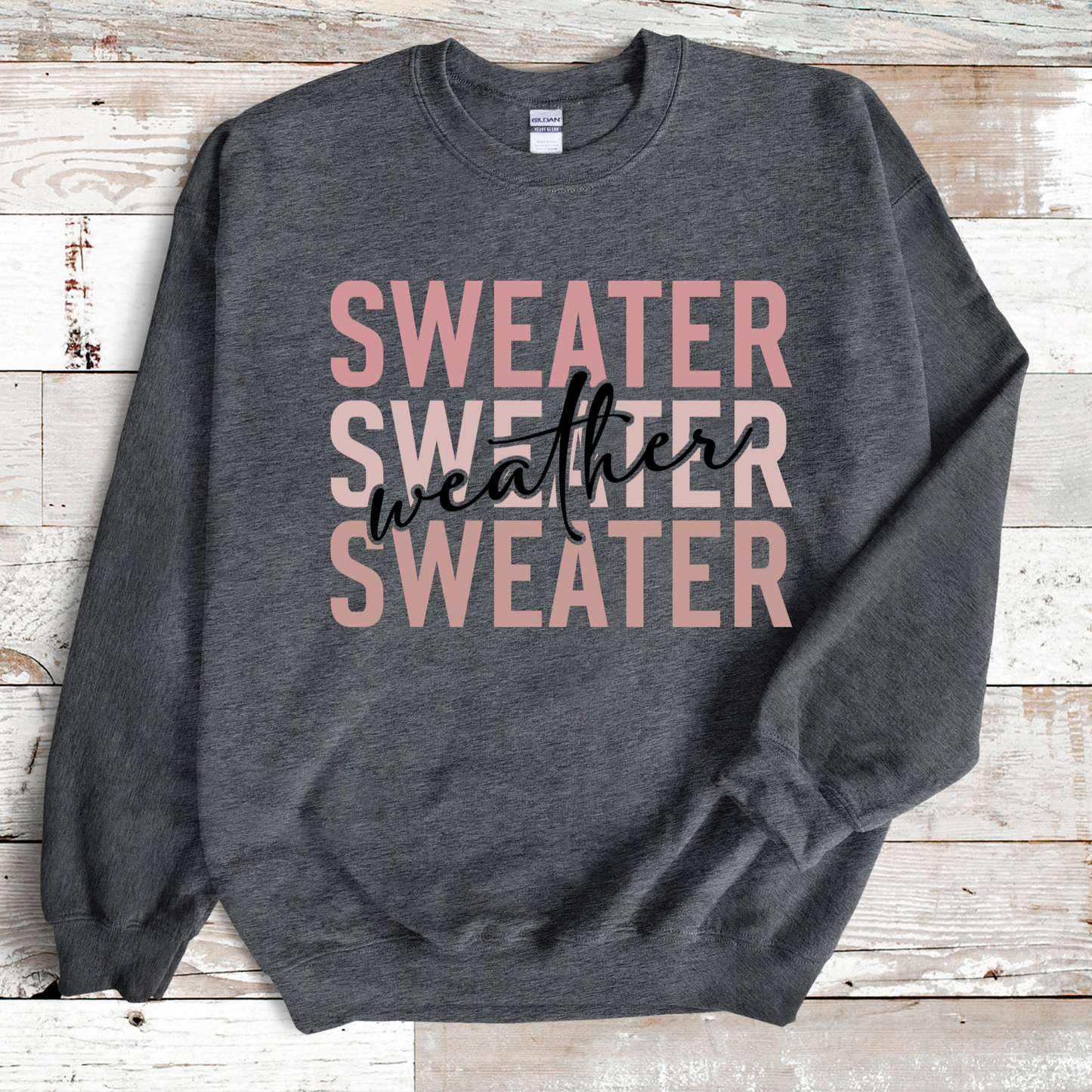 Gray sweatshirt with 'Sweater Weather' text on a wooden surface Sweater Weather - Cute and Chic Minimalist Fall Crewneck Cozy Sweater