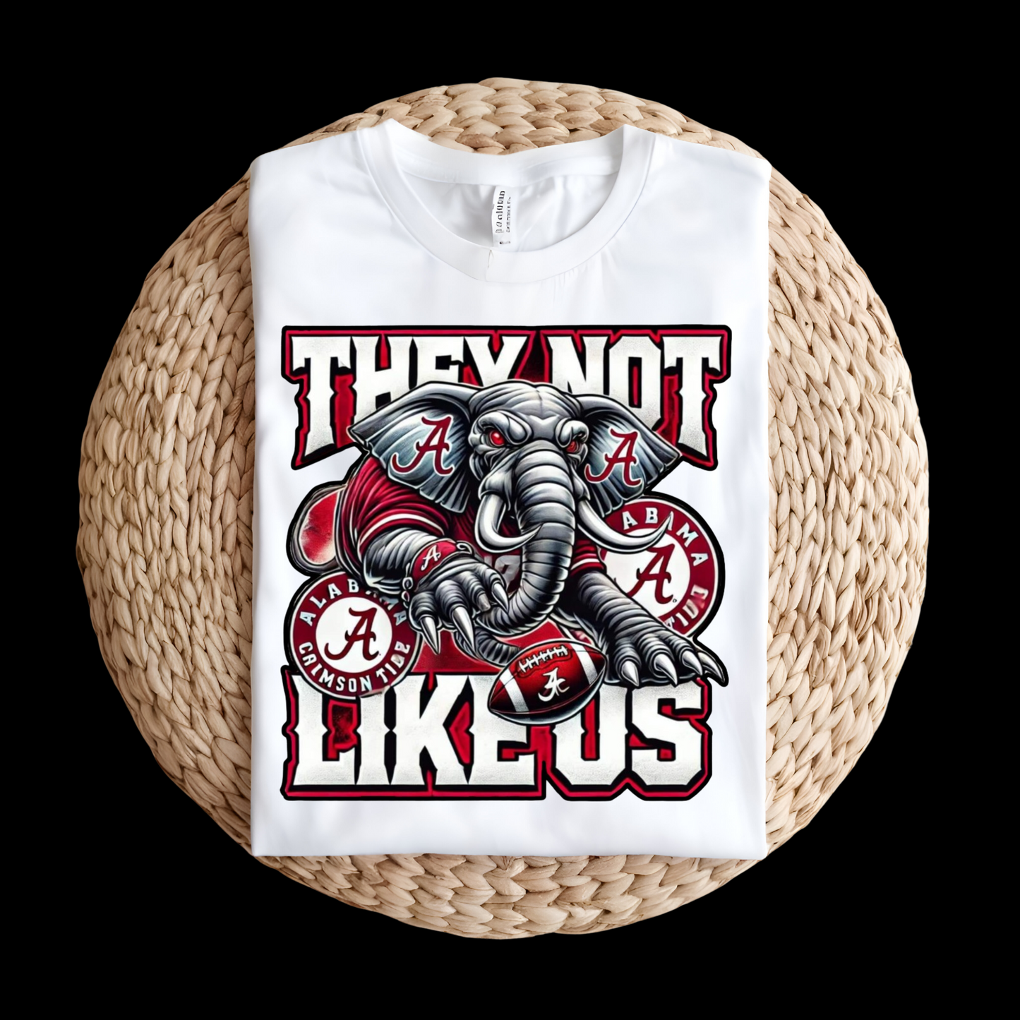 White sweatshirt with elephant graphic and text on a woven surface Alabama Football "They Not Like Us" Alabama Crimson Tide T-Shirt