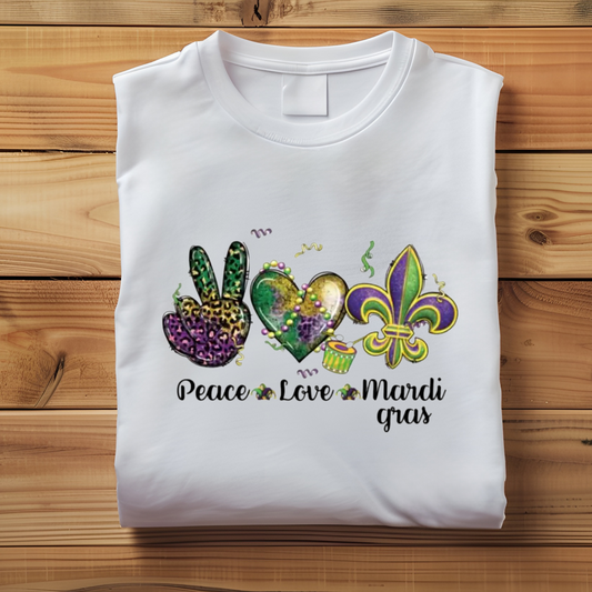 Mardi Gras Sweater with the words "Peace Love Mardi Gras" on a White Soft Cotton Crewneck folded Mardi Gras Sweatshirt sweater