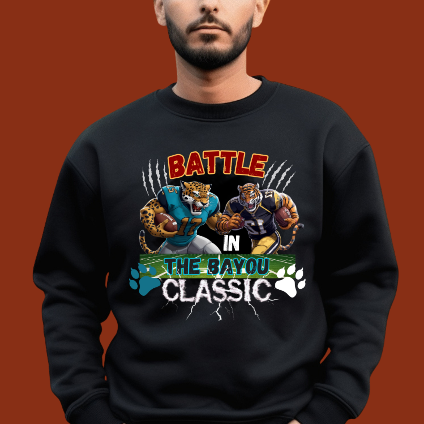 Black sweatshirt with 'Battle in the Bayou Classic' graphic on a brown background Bayou Classic: Battle in the Bayou Classic Game Day Unisex Sweater