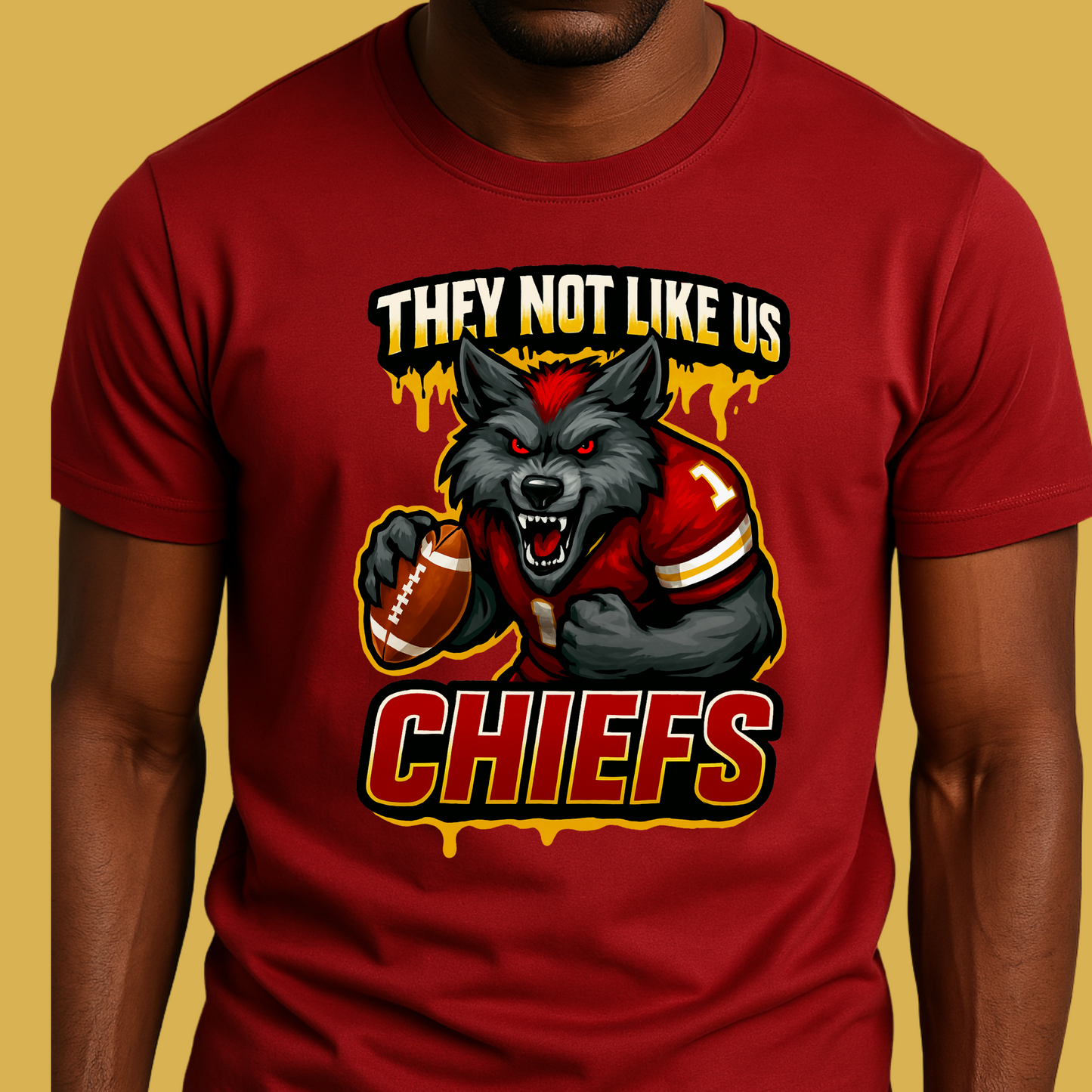 Red t-shirt with a graphic of a wolf holding a football and text 'THEY NOT LIKE US CHIEFS' on a yellow Chiefs Mascot Shirt - Chiefs They Not Like Us Football Game Day Teebackground.