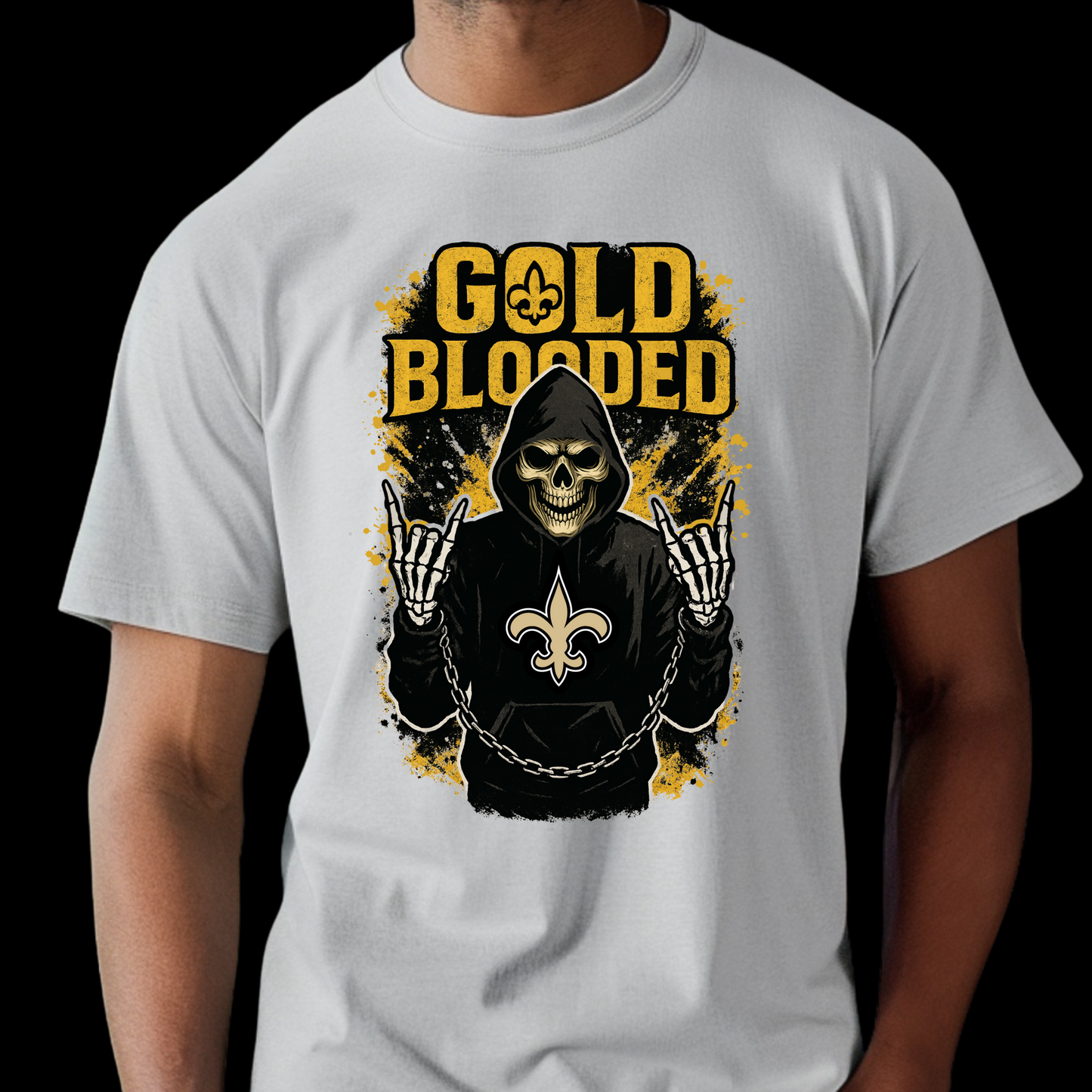 White t-shirt with 'Gold Blooded' graphic design featuring a hooded figure and Fleur-de-Lis symbol. Saints Football Shirt - "Gold Blooded" Saints Game Day Graphic tee